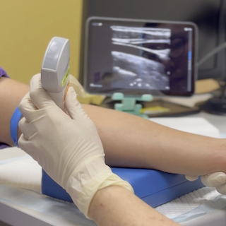 Stabilise the patient’s arm with a cushion